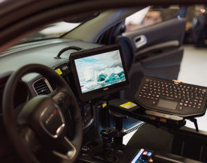 Interior of an emergency vehicle with Havis monitor and mounted keyboard.